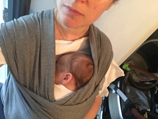 Tiny baby in a carrier, oh my heart...